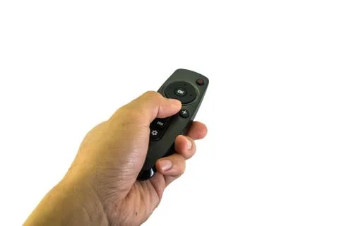 Hand hold remote control and pressing button on white background Foto stock
