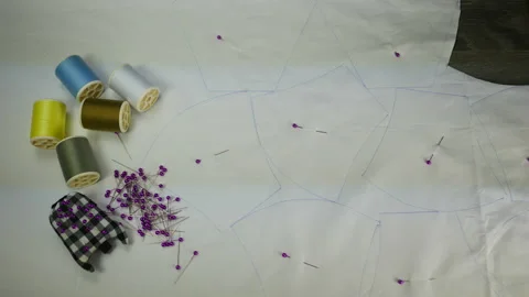 Hand hold scissors cut white cloth pattern, prepare to sew protective mask ,  Stock Footage 131340318