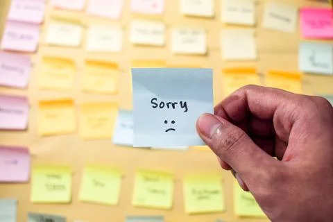 Hand hold sticky notes with words sorry, Motivational words for personal Stock Photos