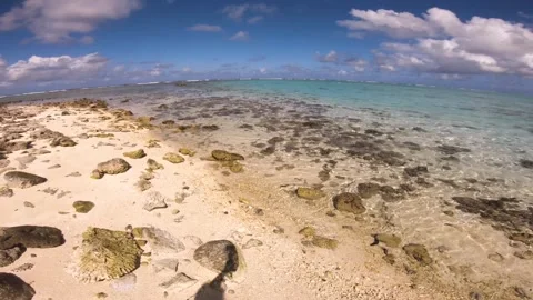 Hand hold still view sandy rocky beach view of beautiful scene of Koromiri  isle Video stock 250401417
