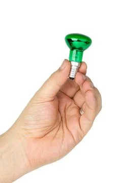 Hand hold tiny green spot tungsten lightbulb Stock Photos