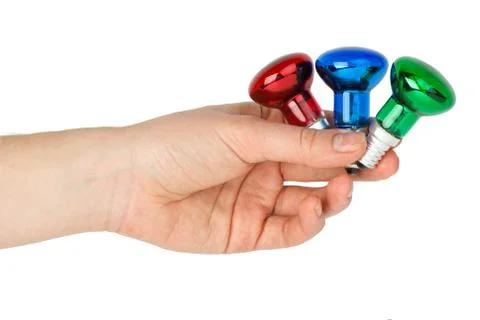 Hand hold tiny red, blue and green spot tungsten lightbulbs  isolated on the  Stock Photos