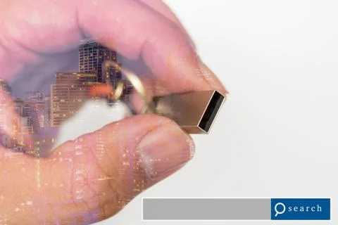 Hand hold USB Flash Drive double exposure with city light with search engin.. Stock Photos