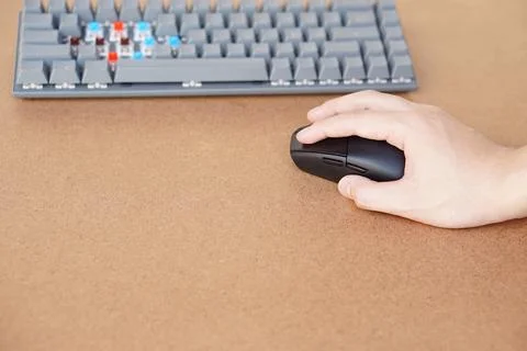 Hand hold wireless mouse with keyboard computer. Stock Photos