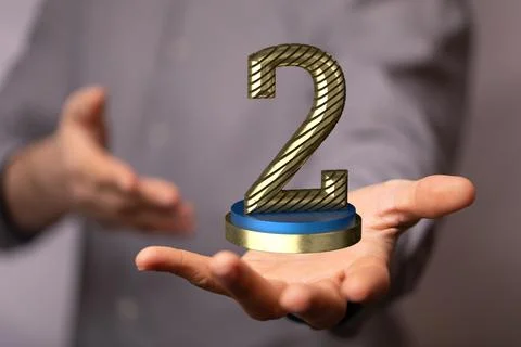 Hand holding a 3D render of a second place trophy 스톡 사진