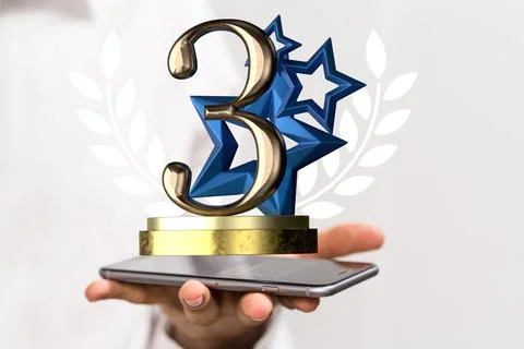Hand holding a 3D render of a third place trophy 스톡 사진