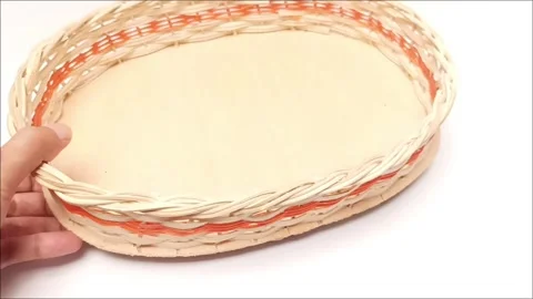 Hand Holding and Rotating Woven Rattan Fruit Basket Tray in Studio Stock Footage 344380658