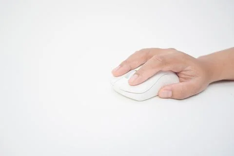 Hand holding and using a white wireless computer mouse on a clean white bac.. Fotos Stock