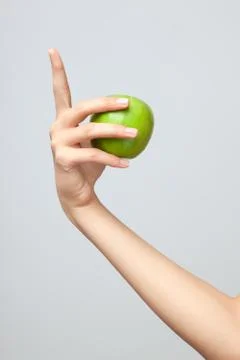 Hand holding apple. Stock Photos