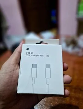 Hand Holding Apple USB-C 60W Charge Cable Retail Box Close Up Stock Photos