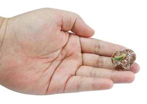 Hand Holding Assorted Round Chocolate Candy Ball Stock Photos