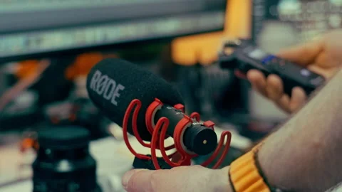 Hand holding audio recorder microphone recording studio equipment Stock Footage 336099656