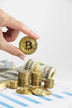 Hand holding bitcoin coin stack Stock Photos