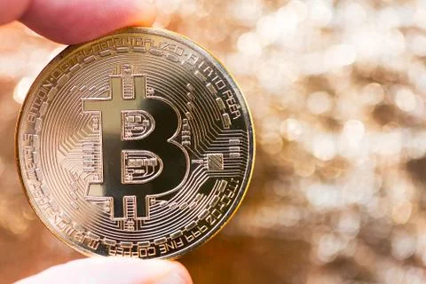 Hand holding a bitcoin 스톡 사진