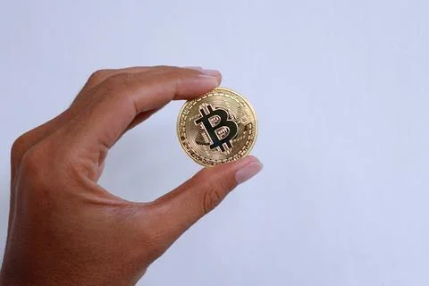 Hand holding bitcoin Stock Photos