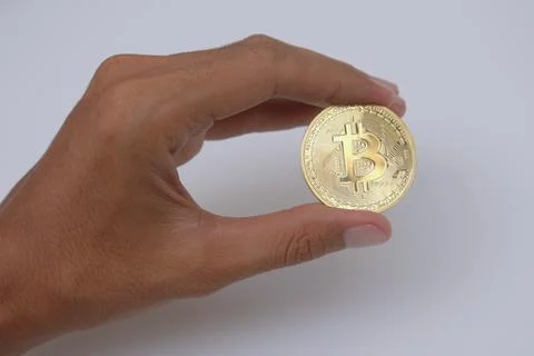 Hand holding bitcoin Stock Photos