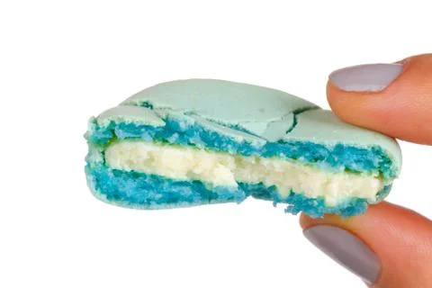 Hand Holding Bitten Macaron Stock Photos