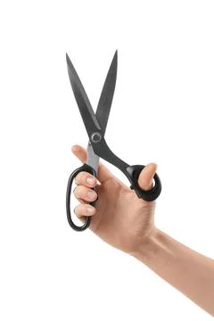 Hand holding black scissors with open blades, cutting and crafting tool, isol Stock Photos