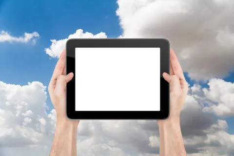 Hand holding blank tablet on cloudy Stock Photos