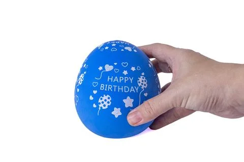 Hand holding a blue egg shaped kitchen timer isolated on white background Stock Photos