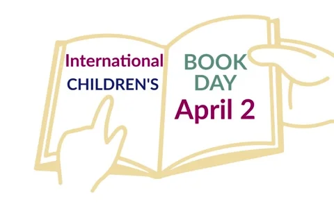 Hand holding a book and text  international children's book day April 2 video Stock Footage 172815795