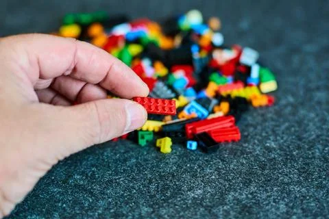Hand Holding Bricks - Creative Play Concept Stock-Fotos