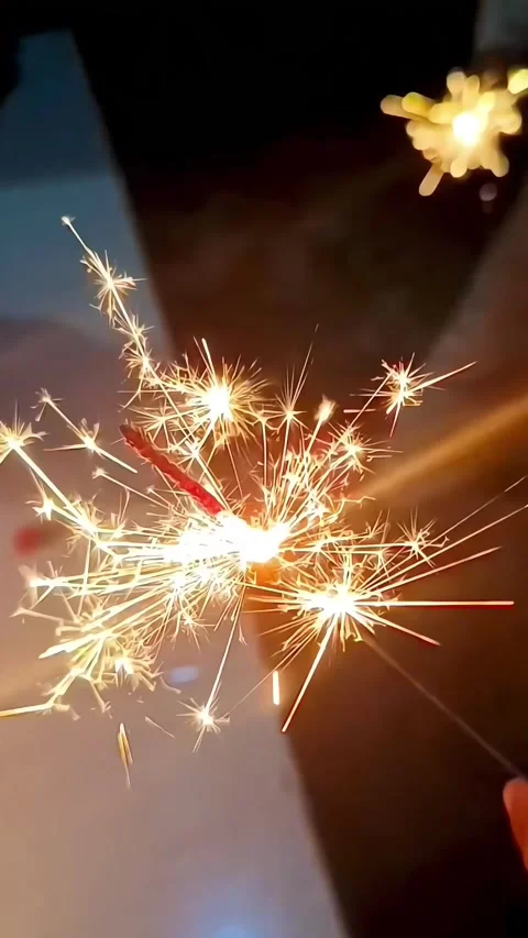 Hand Holding Bright Sparkler Firework at Night, Burning Sparkler Stock Footage 329588702