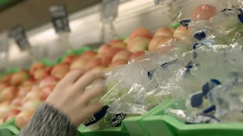 Hand holding a bunch of grapes Stock Footage 67981127