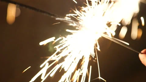 Hand holding a burning sparkler Video stock 60643618