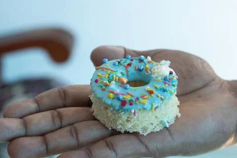 Hand holding a cake Stock Photos