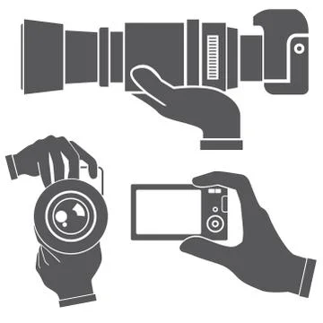 Hand holding camera Stock Illustration