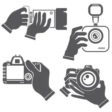 Hand holding camera Stock Illustration
