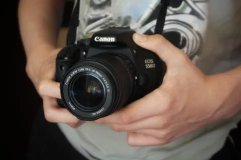 A hand holding a camera Stock Photos