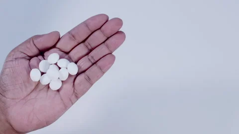 A Hand Holding Camphor Balls Stock Footage 248759986