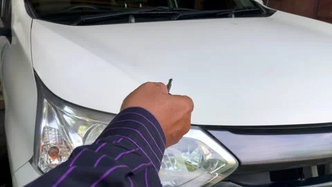 Hand holding car remote key locking or unlocking vehicle Stock Footage 330152801