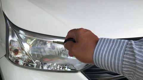 Hand holding car remote key locking or unlocking vehicle Stock Footage 330152820