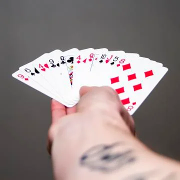 Hand holding cards Stock Photos