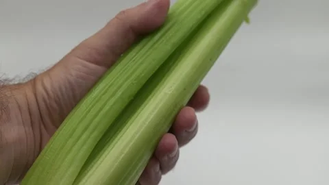 Hand holding celery stock Video stock 279934600