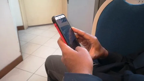 Hand holding cell phone is browsing the internet. Stock Footage 95826583