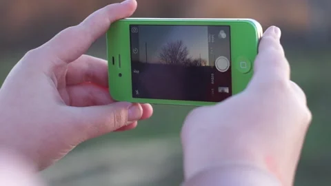 A hand holding a cellphone Stock Footage 130504867