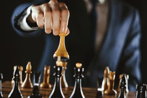 Hand holding chess Stock Photos