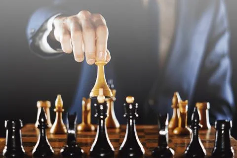 Hand holding chess 库存照片