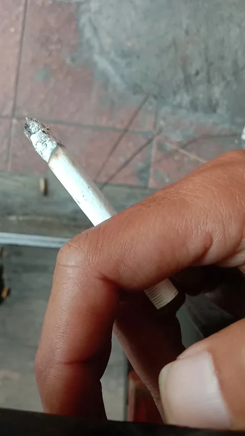 Hand holding cigarette Stock Footage 280288906