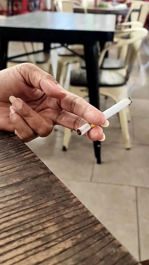 Hand Holding A Cigarette Stock Footage 323322799