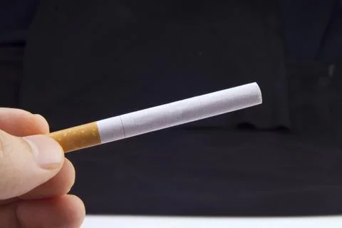 Hand holding a Cigarette Stock Photos