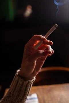 Hand holding cigarette Stock Photos