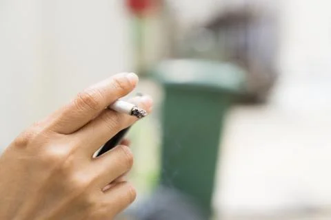 Hand holding cigarette Stock Photos