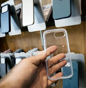 Hand Holding Clear iPhone Case in Store Stock Photos