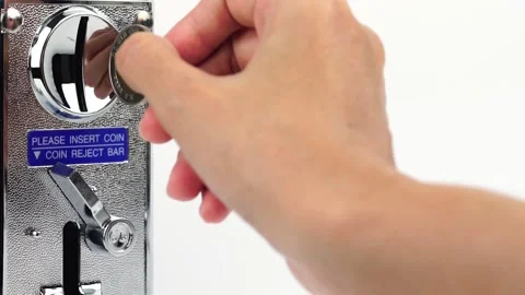 Hand holding a coin, vending machine on a white background. Stock Footage 169209568