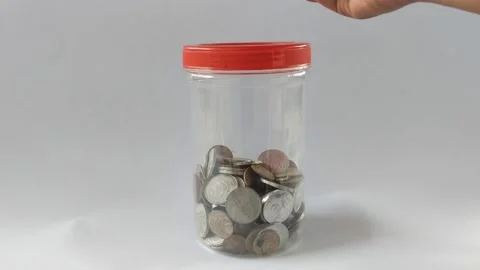Hand holding coins Stock Footage 220770134